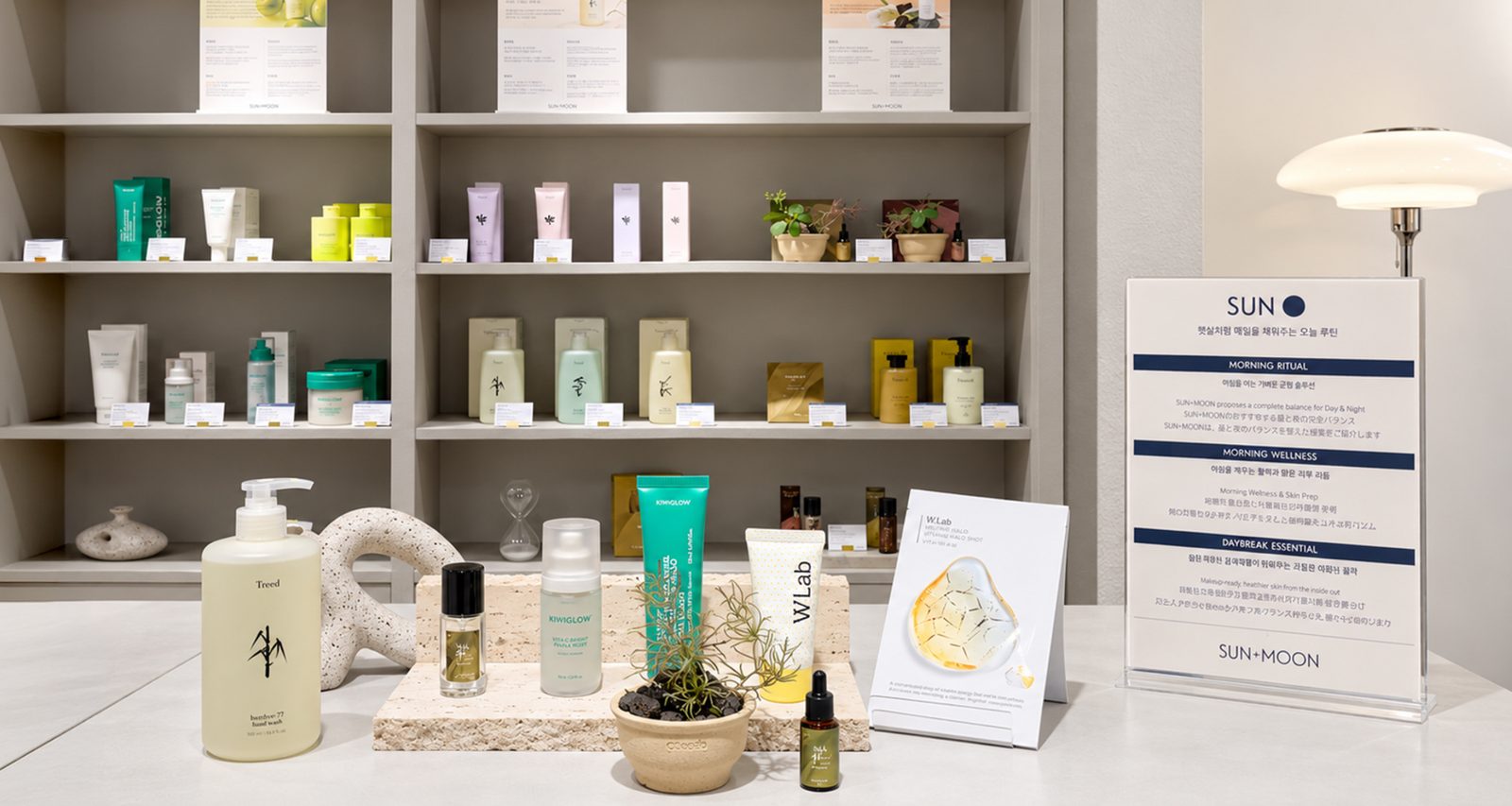 SUN+MOON display table with Treed, KIWIGLOW and W.Lab products and the SUN morning routine card